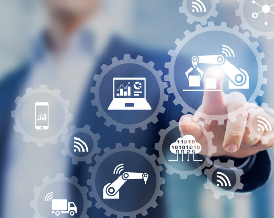 Smart factory and industry 4.0, robots, IoT, cloud computing technology Smart factory and industry 4.0 concept with connected production robots exchanging data with internet of things (IoT) and cloud computing technology, businessman touching interface with icons in gears